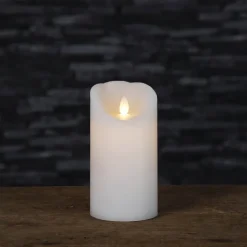 Blockljus med glimmande låga